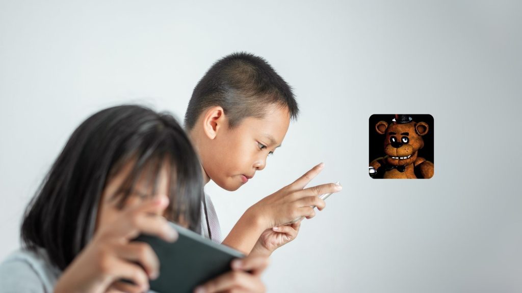 Two children using smartphones, focused on their screens. On the right side of the image, an icon features Freddy Fazbear from the game Five Nights at Freddy’s against a plain white background—a scene parents might see while reading a game review.